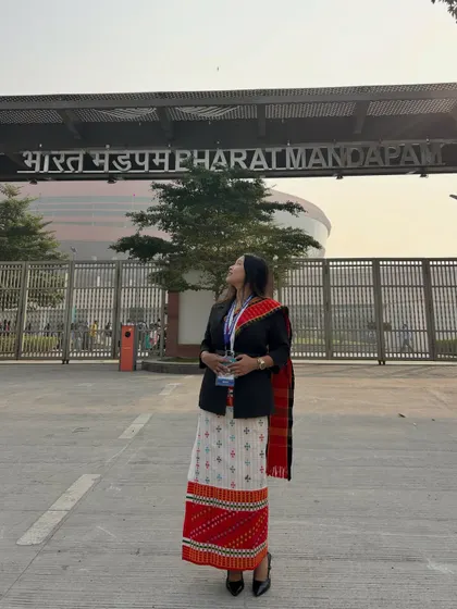 Standing outside the Bharat Mandapam in New Delhi, the venue for the national health conference.