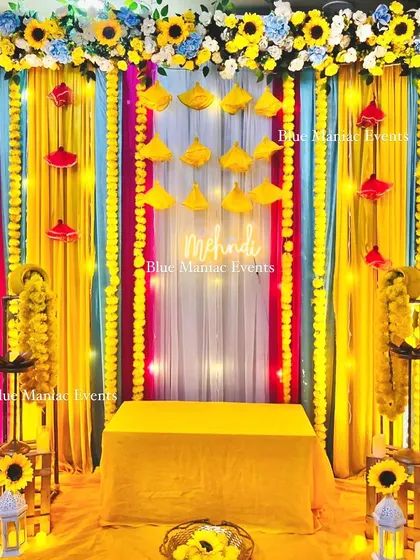 The final look of the vibrant and compact Mehendi setup. This shows that even a small space can be transformed into a full-vibe celebration corner.