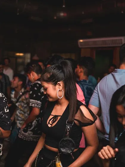 A snapshot of the dance floor, filled with people moving to the hip hop beats.