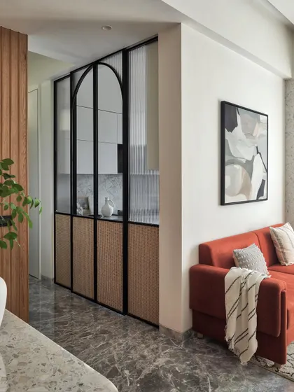 A kitchen masterpiece designed for both style and functionality. The arched sliding doors with fluted glass and cane panels create a beautiful screen, while the serene neutral tones provide a calming ambiance.