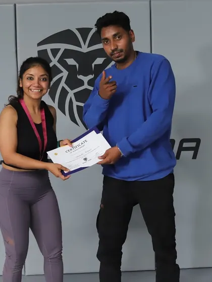 A moment of victory. One of our gold medal winners receiving her certificate at the Reign MMA tournament.