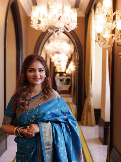 Elegance personified. This shot captures the actress in a grand hallway, looking absolutely regal in her traditional attire.