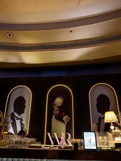 The full view of the Jazz Club bar, with its arched, backlit portraits of jazz legends. This custom-designed bar was a major focal point and conversation starter.