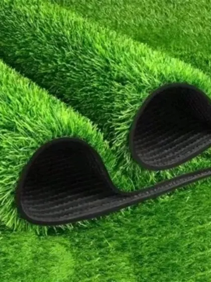 A close-up view of the dense, multi-toned blades of the artificial grass, which gives it a very realistic appearance.