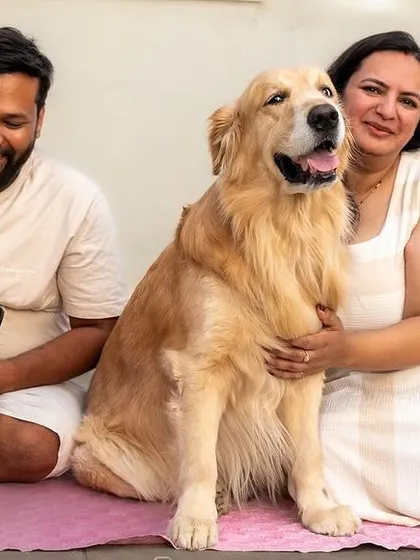 A happy family portrait on the terrace with their three dogs. Managing multiple pets is my specialty, and the result is a photo that truly represents the whole pack.