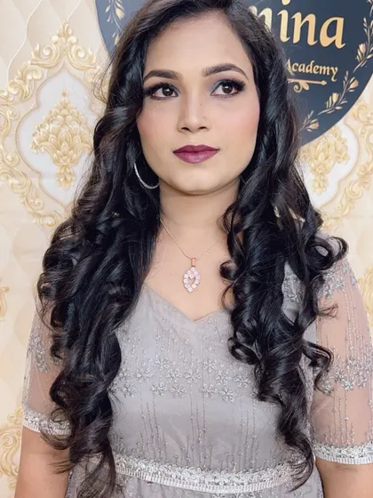 A portrait of the client in the grey dress, looking elegant and poised.