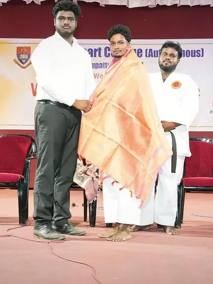 Receiving a token of gratitude from the college. It was an unforgettable day, returning to my alma mater as a special guest to share my knowledge of karate.