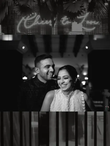 Laughter under a 'Cheers to Love' sign at a Sangeet night in Goa. This black and white shot freezes a genuine, candid moment, showing the fun and energy of wedding celebrations.