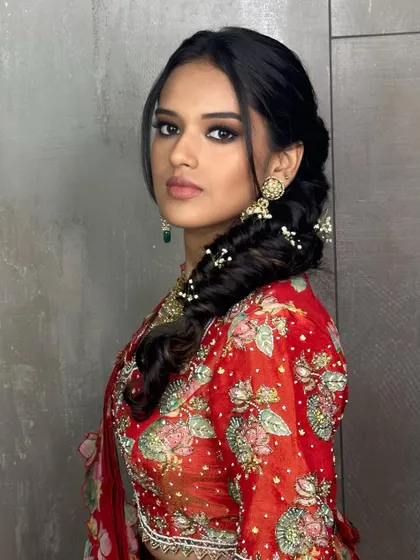 A bold and beautiful Mehendi look. I created a dramatic smokey eye and paired it with an intricate side braid adorned with baby's breath.