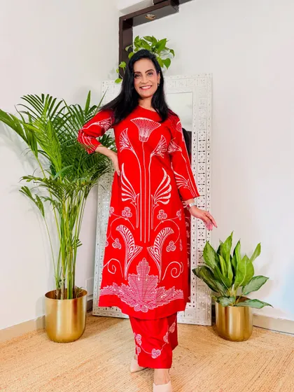 This bright red kurta set with a bold white print is a statement piece. It's perfect for when you want to wear something confident and eye-catching.