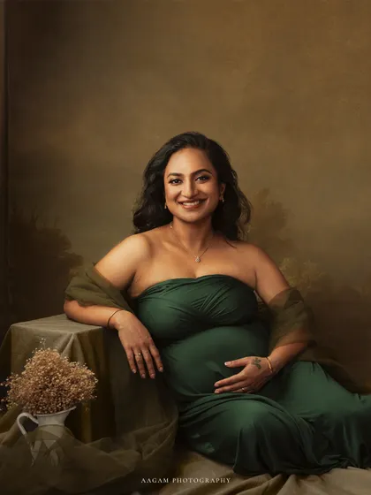 Relaxed and radiant, she leans against a table, the picture of serene confidence. This image was shared to celebrate the strength and beauty of women.