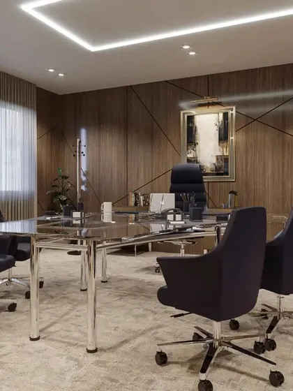 A wider view of the executive conference room, showcasing the recessed ceiling lighting that provides even, glare-free illumination. The overall design ensures a professional and focused atmosphere for important meetings and collaborations.