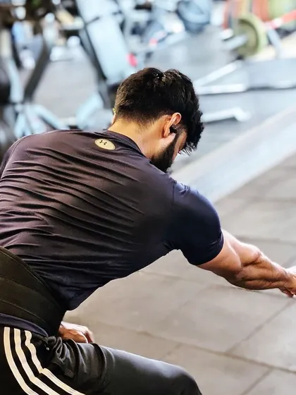 "Kill the boy and let the man be born." A single-arm cable row, focusing on isolating one side of the back for balanced development.