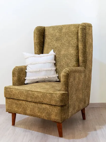 A duplicate of image 221, again showing the full profile of the custom-made wingback chair.