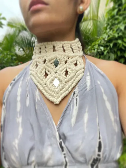 A front view of the statement choker necklace. The geometric pattern and the sparkle of the embedded mirrors are designed to catch the eye. It's a perfect accessory for when you want to stand out.