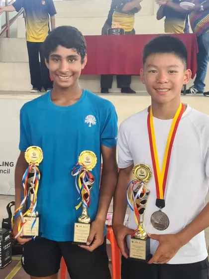 Tavish Pahwa with his partner Alex Hui after winning the doubles title at the Asian Grade A tournament in Malaysia. International partnerships broaden our players' experience.