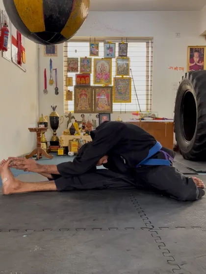 A seated wide-legged forward fold, another excellent stretch for opening up the hips and improving hamstring flexibility.