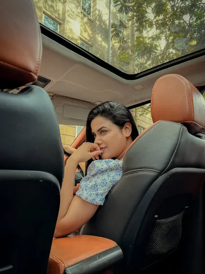 A playful and engaging shot from the backseat perspective.