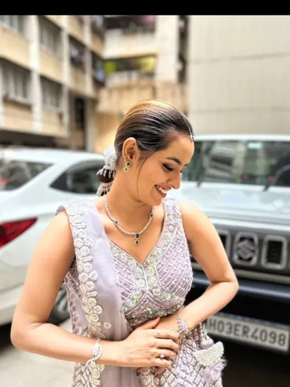 A candid, happy shot of a client in our lavender lehenga.
