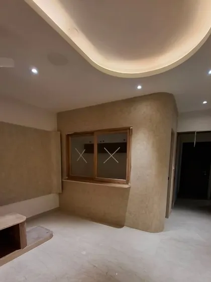 Designing with the flow. This image captures the beautiful curves of the ceiling and walls, creating a seamless and elegant space even before the furniture arrives.