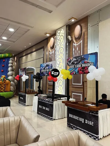 It's not just about decor, it's about the fun. I set up themed game booths like 'Fast Lane Balance' and 'Balancing Disc' to keep the kids entertained at this racing party.