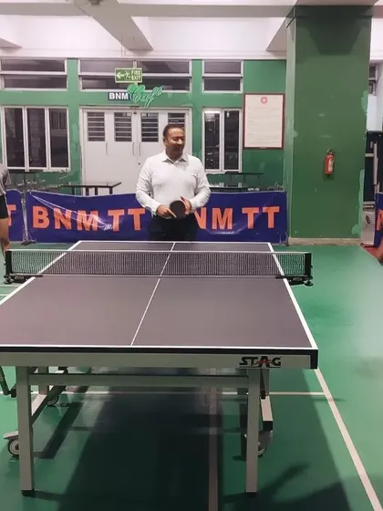Prof. Eishwar N Maanay takes the inaugural serve on the new table, officially adding it to our training facility.