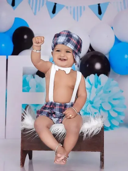 A powerful pose from our Boss Baby, cheering with his fist in the air. This shot perfectly captures the confident and playful spirit of the theme.
