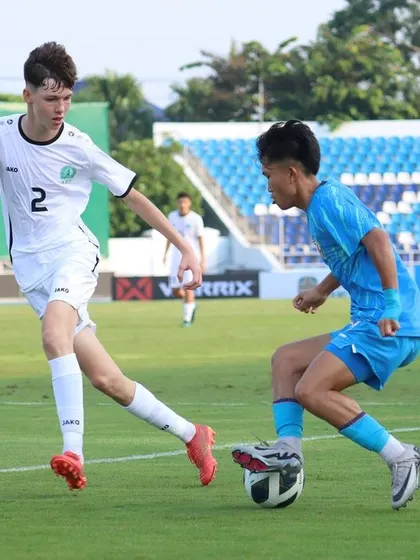 An Indian U17 player showcases agility and close control to shield the ball from a defender. Our training develops the low center of gravity and quick footwork needed for these one-on-one situations.
