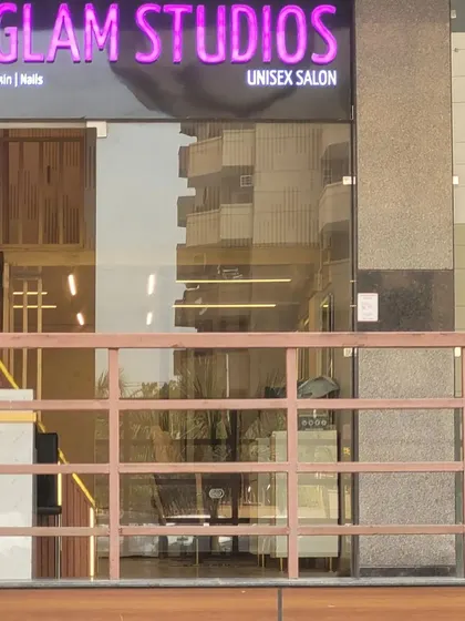 The exterior of our unisex salon, clearly marked with our brand. We offer a full range of services for everyone, including hair, makeup, skin, and nails, making us a one-stop beauty destination.