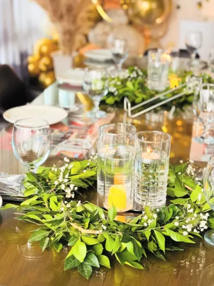 The candlelight adds a warm and intimate glow to the Aqeeqa dinner celebration.