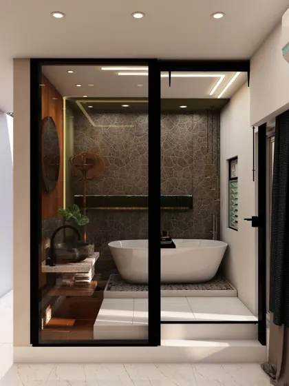 The glass partition separating the bedroom and bathroom, a bold design choice that enhances the sense of space and luxury in a master suite.