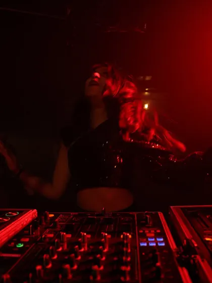 Hair flying, lost in the moment. This photo captures the physical energy I put into every set, dancing right along with the crowd.