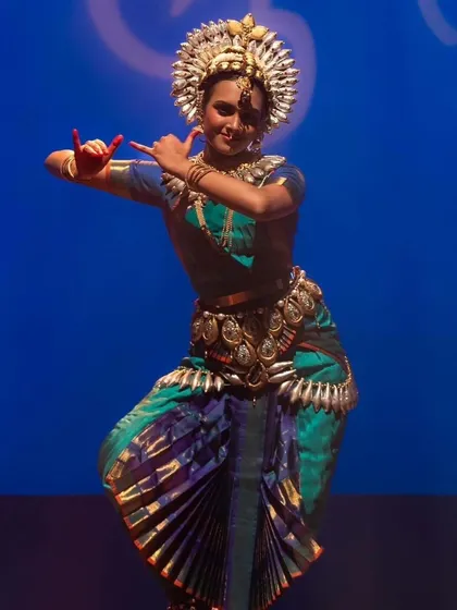 Meenakshi in another powerful pose, showcasing the strong lines and graceful mudras that are fundamental to Bharatanatyam. Each performance is a new chapter in a student's artistic story.