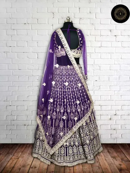 A still shot of the purple velvet lehenga, showing how the silver work catches the light. A perfect outfit for an evening wedding function.