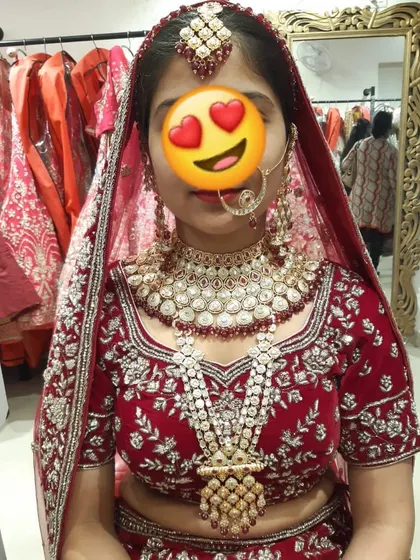 That happy feeling when you find the perfect bridal set. This client is trying on a full layered Kundan and Polki set at my store.