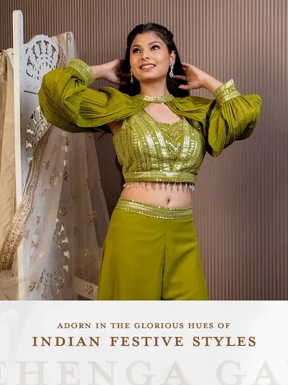 Adorn yourself in the glorious hues of Indian festive styles. This olive green palazzo set with a unique cape-style blouse is a modern and chic choice for a mehendi or sangeet.