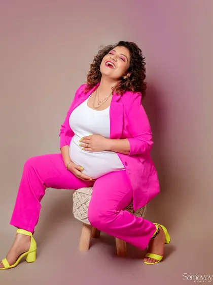 Pure joy! This laughing portrait is infectious. It shows that maternity shoots can be fun, energetic, and full of personality.