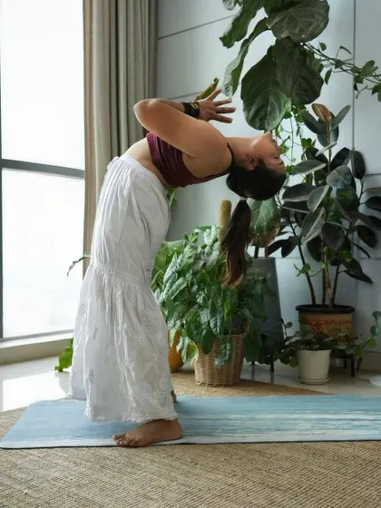 A standing backbend, opening the heart and chest while maintaining a strong, grounded foundation.