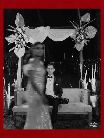 An artistic shot using motion blur, capturing the bride in movement while the groom sits in focus, creating a dynamic and modern portrait.