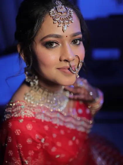 A close-up portrait of a North Indian bride, her eyes beautifully defined and her skin glowing.