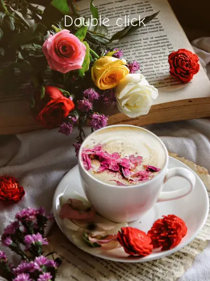 A slightly different angle of the floral coffee flatlay, with "Double click" text overlay. The warm lighting and vibrant colors make it an engaging social media post.