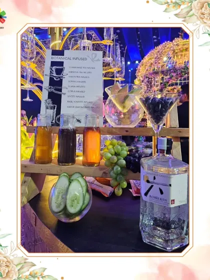 A close-up of the infused botanical bar, showcasing fresh ingredients like cucumber and grapes alongside premium Roku Gin. Guests can create their own unique gin cocktails.