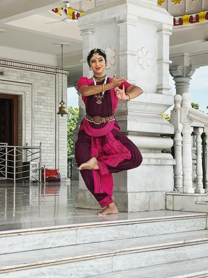 Striking a pose at a Lakshmi temple in between SPIC MACAY workshops. The architecture of temples, with their dancing sculptures, is a constant source of inspiration.