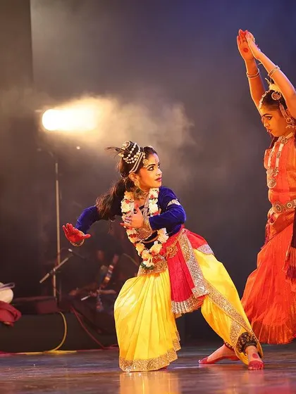 A dynamic interaction between two dancers during our "Nrithya Milanam 2023" show. The energy and precision in their movements highlight the rigorous training behind our performances.