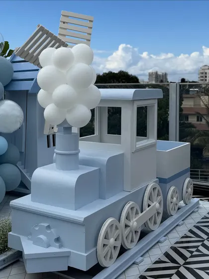 A detailed shot of our light blue train prop, which can be used as a photo booth or a creative dessert display table for a transportation-themed event.