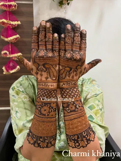 A beautiful shot of the back of the hands for this peacock design.