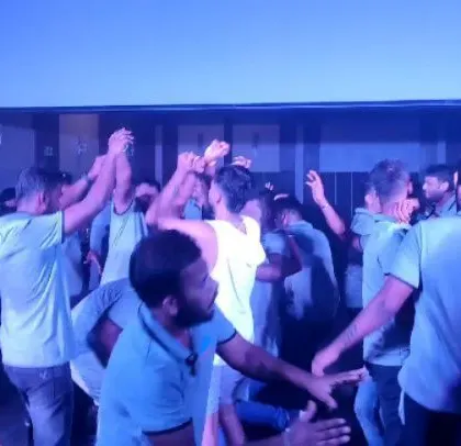 A moment of group dancing at the Kannada-themed corporate event.