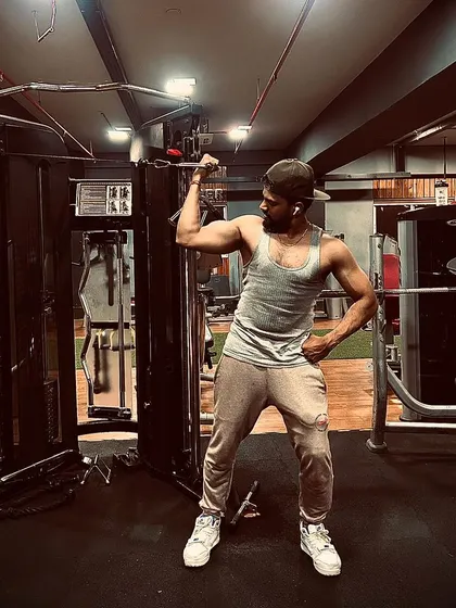 The "Me vs Me" philosophy in action. Every workout is a chance to be better than you were yesterday, and this bicep pose captures that spirit of self-improvement.