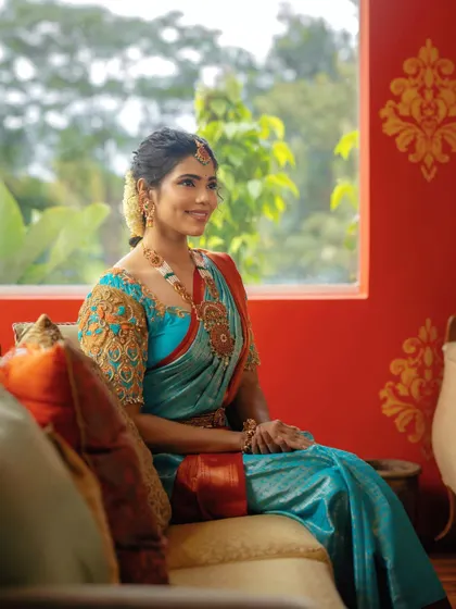 A serene and elegant portrait. The makeup is timeless and sophisticated, perfect for this traditional look.