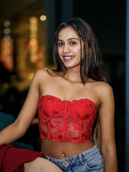 A guest rocking a red corset top, perfectly fitting 'THE RED DANCE' theme.